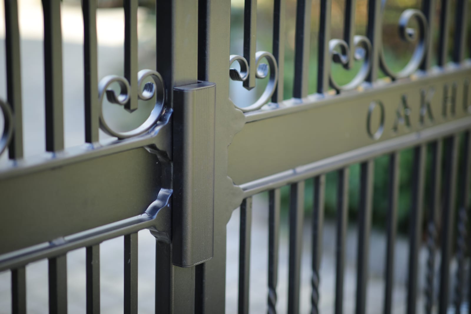 Close-up of a heavy-duty iron gate hinge — quality engineering and finish